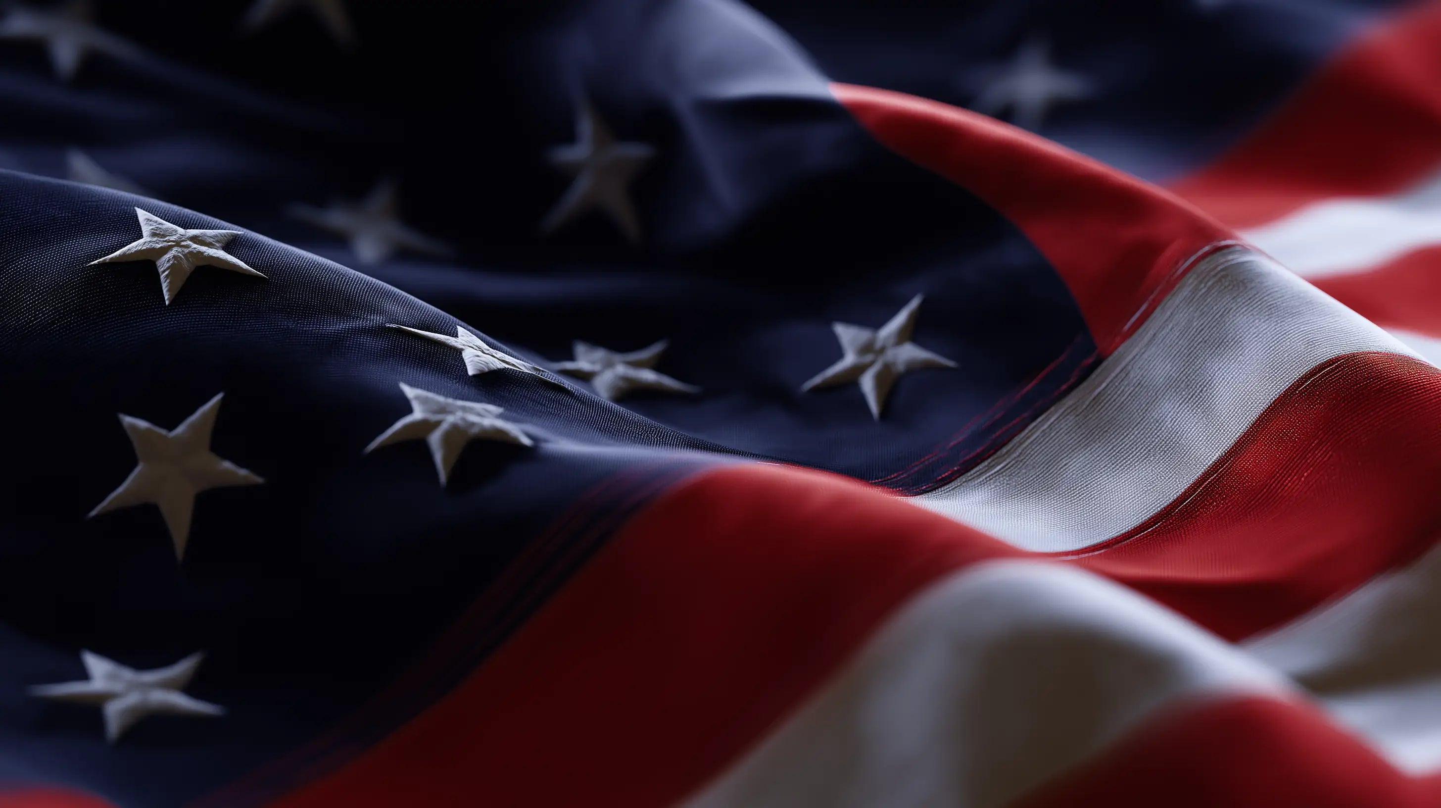 Close-up of a waving American flag in soft focus