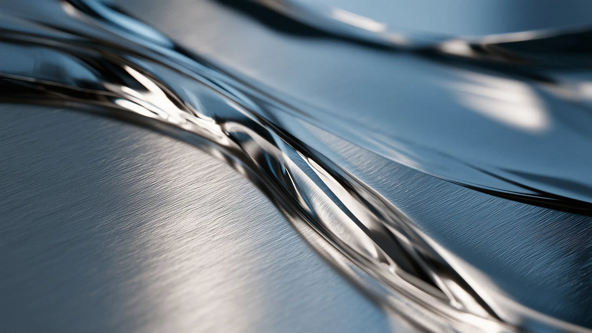 Clear oil flowing over steel for the Tech Tool Oemeta broaching oil guide