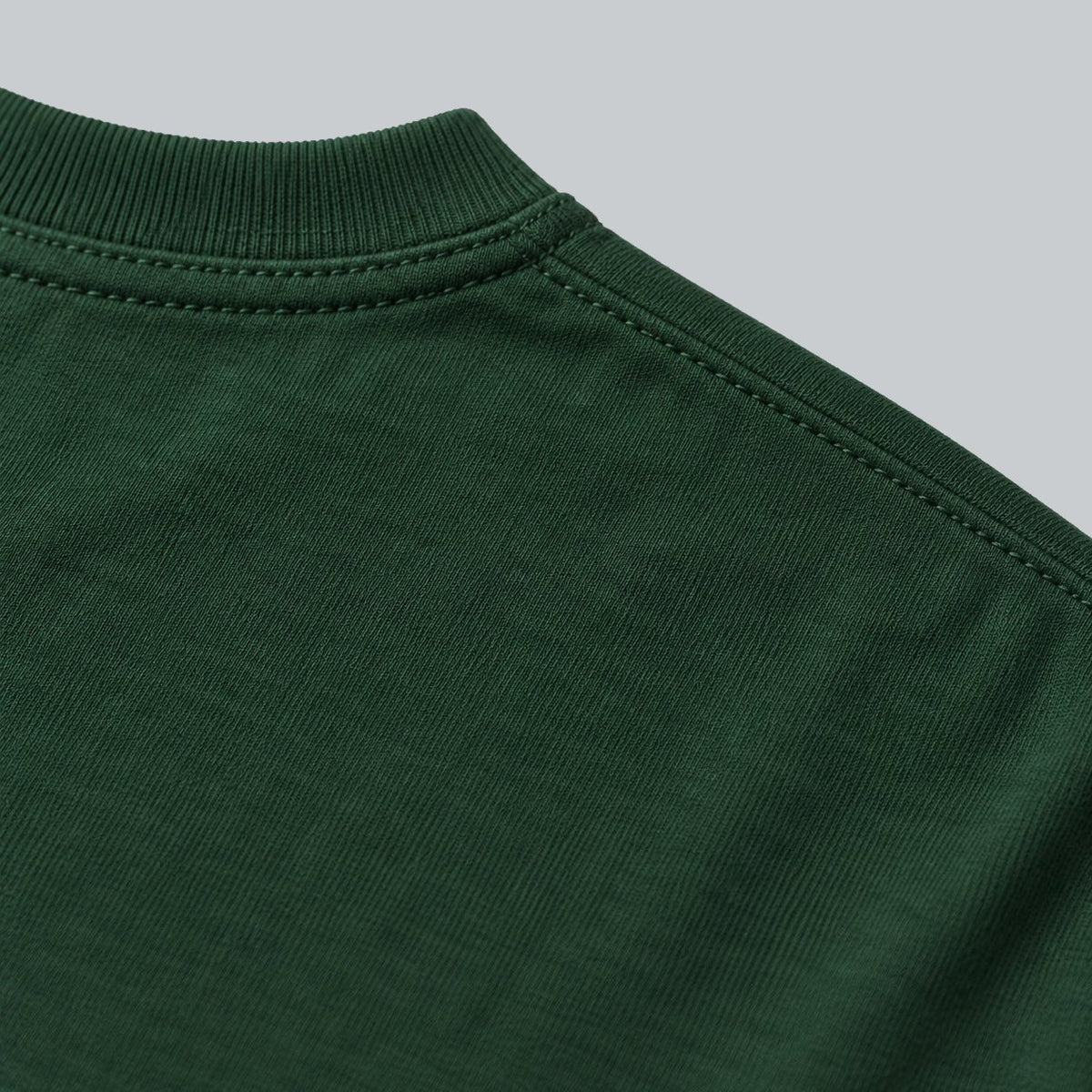 Premium Unisex Tech Tool Core T-Shirt, back construction macro showing crew neckline, shoulder stitching and cotton jersey | Color: Forest Green