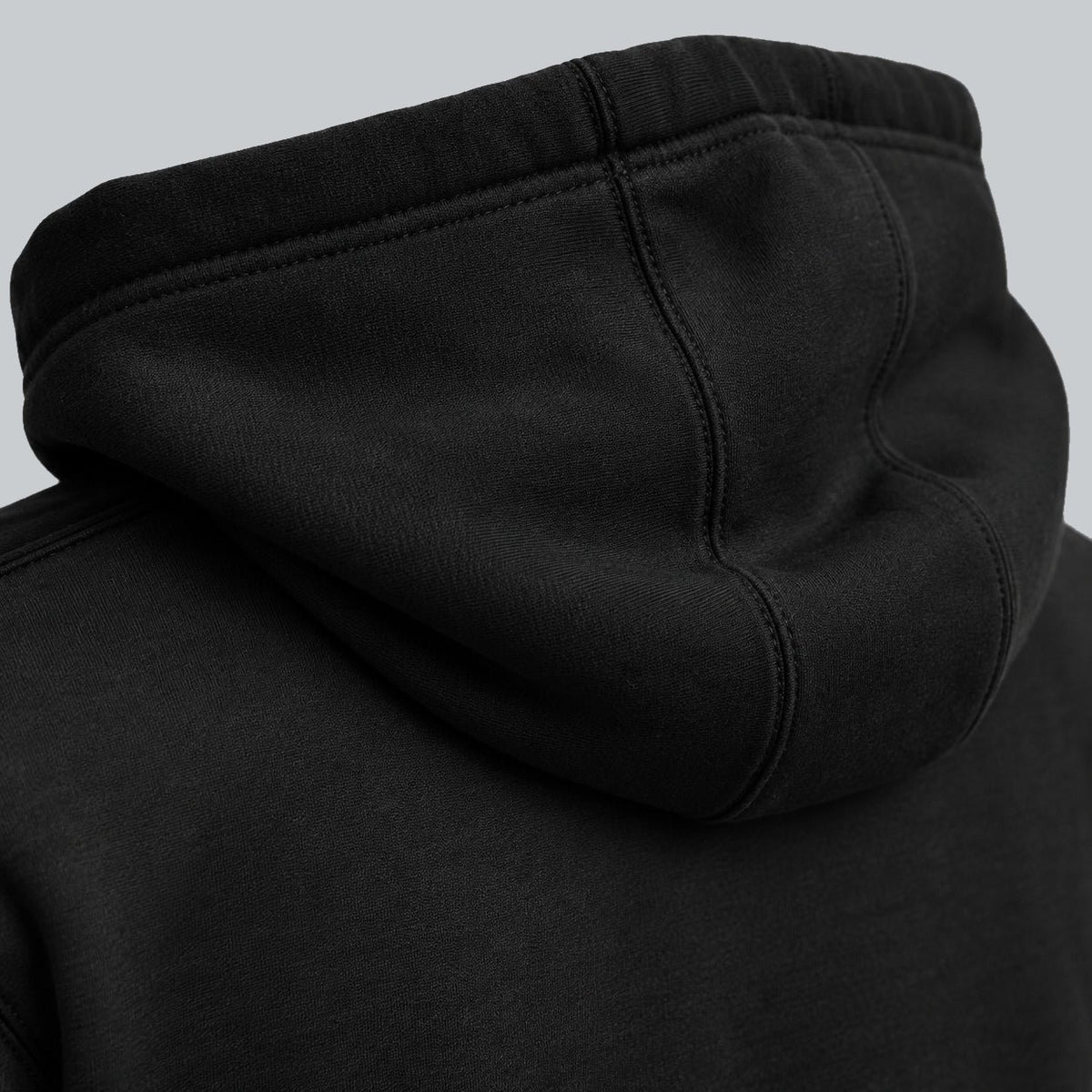 Premium Unisex Tech Tool Core Pullover Hoodie, back construction macro showing hood seam and cotton-blend fabric | Color: Black