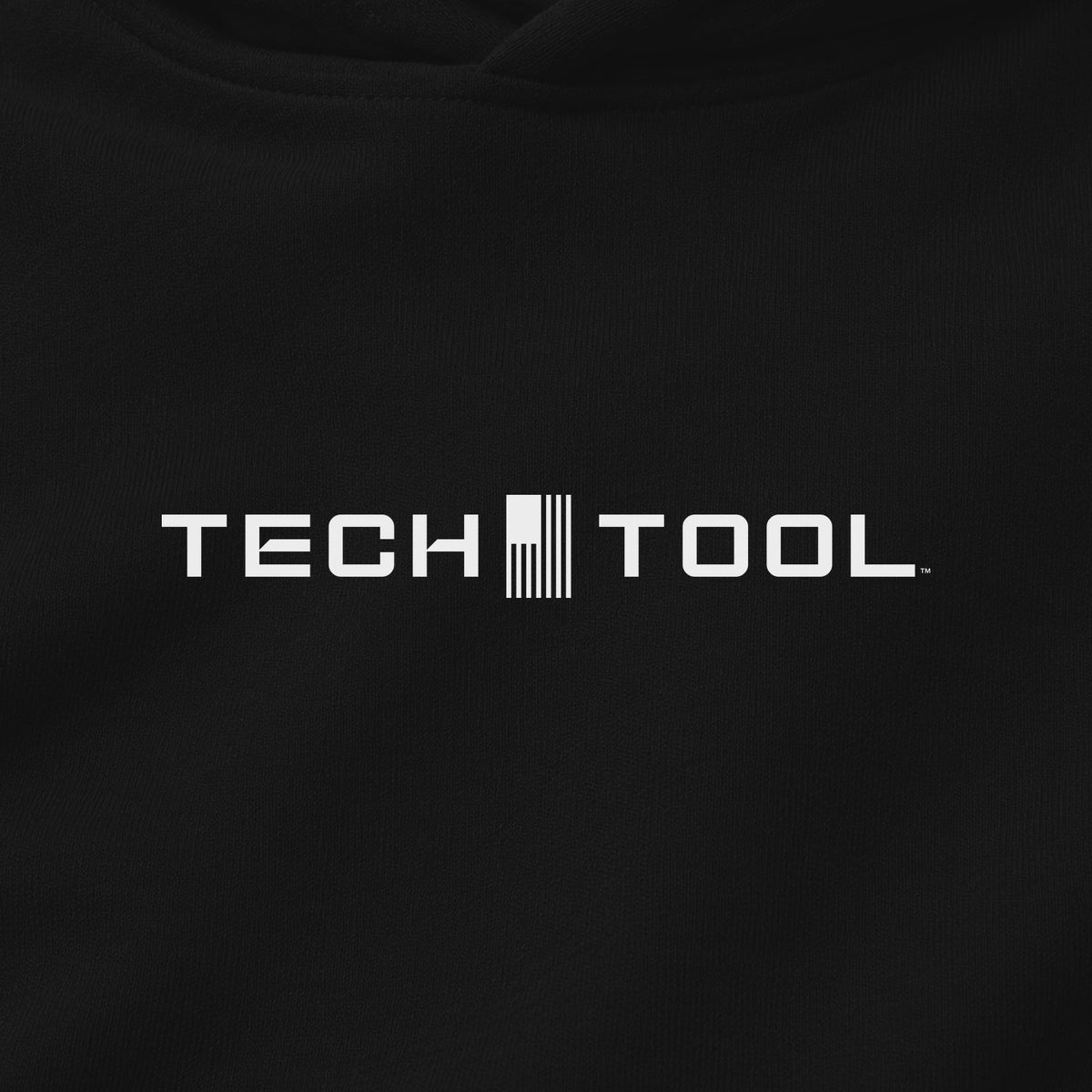 Premium Unisex Tech Tool Core Pullover Hoodie, centered chest-print close-up showing Tech Tool logo and cotton-blend fabric | Color: Black