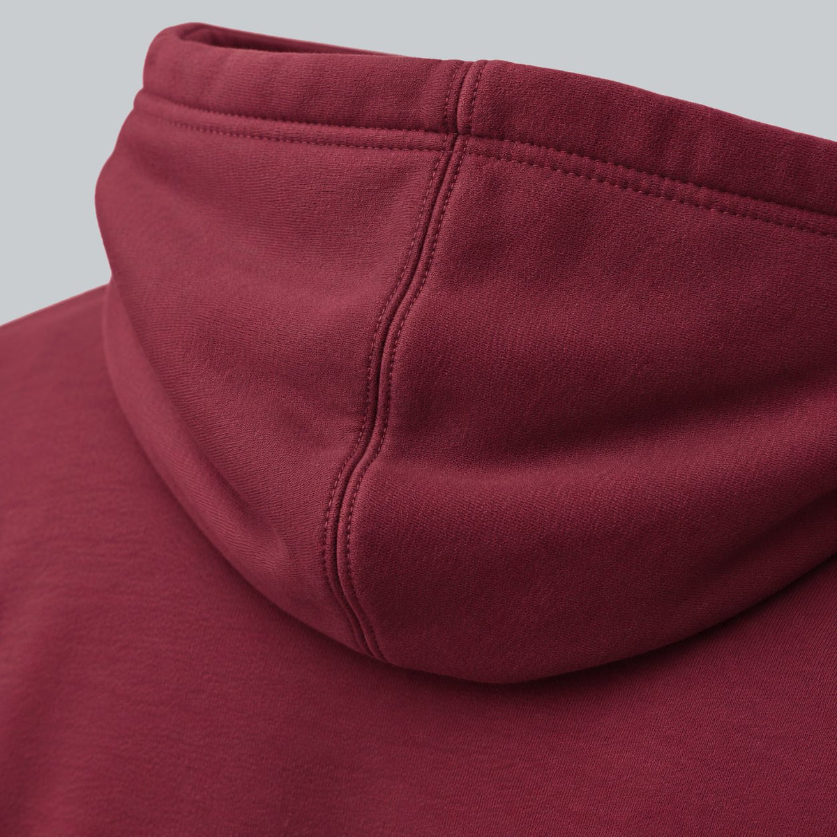 Premium Unisex Tech Tool Core Pullover Hoodie, back construction macro showing hood seam and cotton-blend fabric | Color: Pomegranate