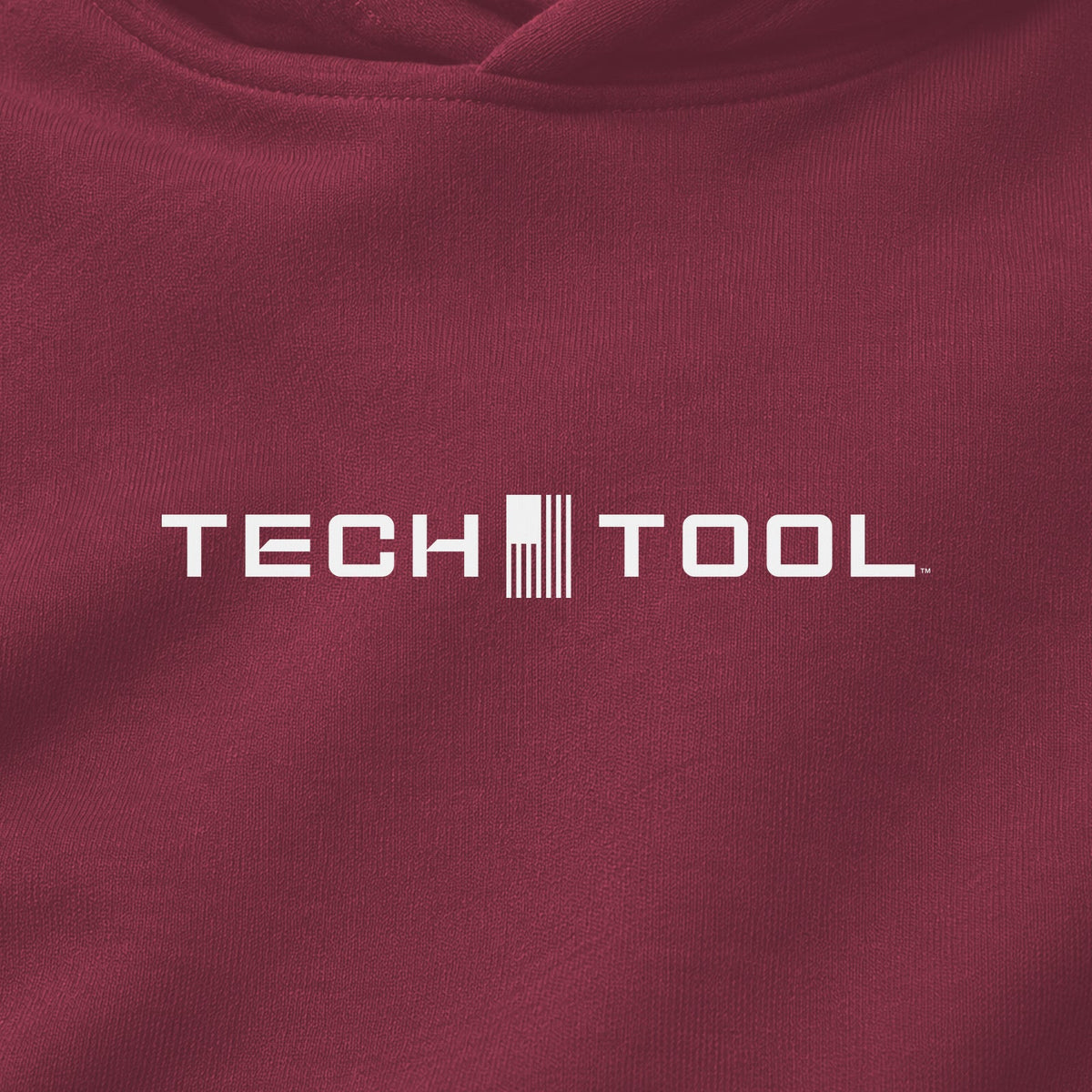 Premium Unisex Tech Tool Core Pullover Hoodie, centered chest-print close-up showing Tech Tool logo and cotton-blend fabric | Color: Pomegranate