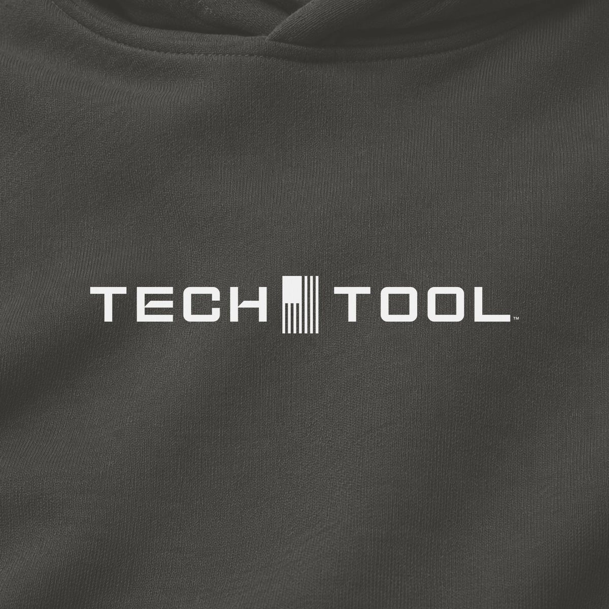 Premium Unisex Tech Tool Core Pullover Hoodie, centered chest-print close-up showing Tech Tool logo and cotton-blend fabric | Color: Vintage Black