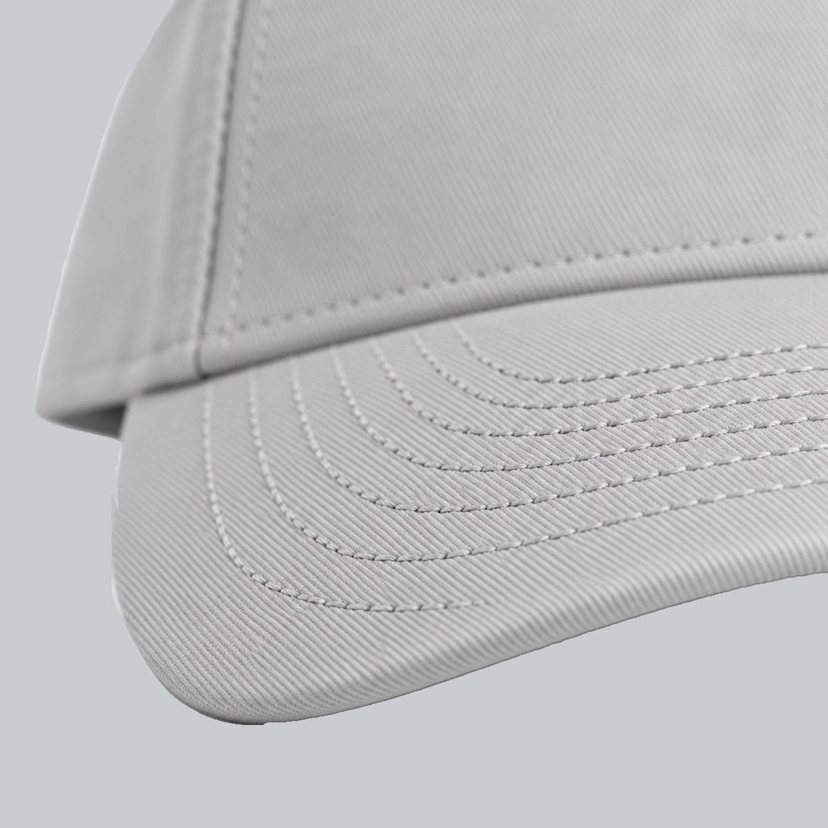 Tech Tool Core Frame Cap, oblique macro of curved brim, parallel stitching and gray cotton twill | Color: Storm