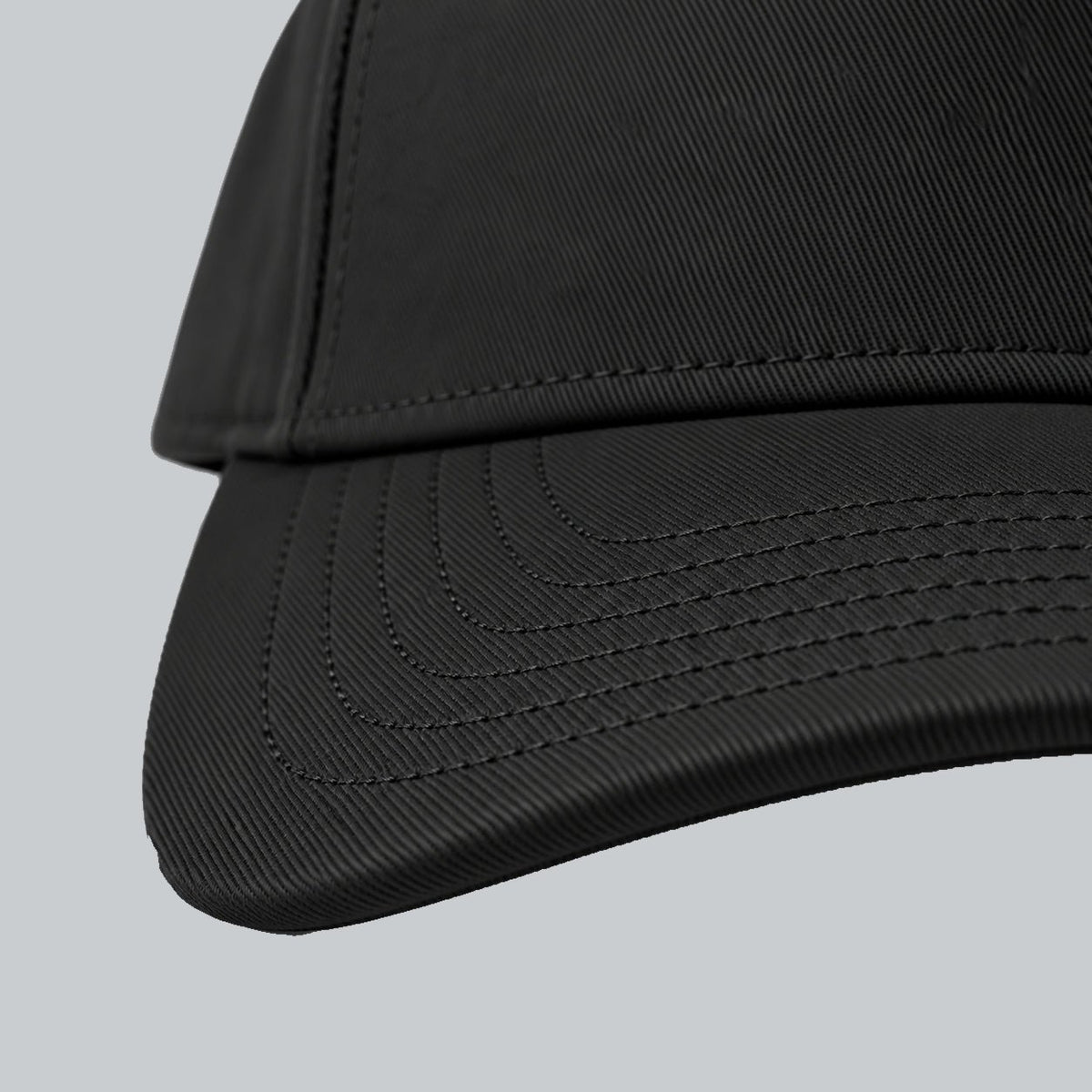 Tech Tool Core Frame Cap, oblique macro of curved brim, parallel stitching and cotton twill | Color: Black