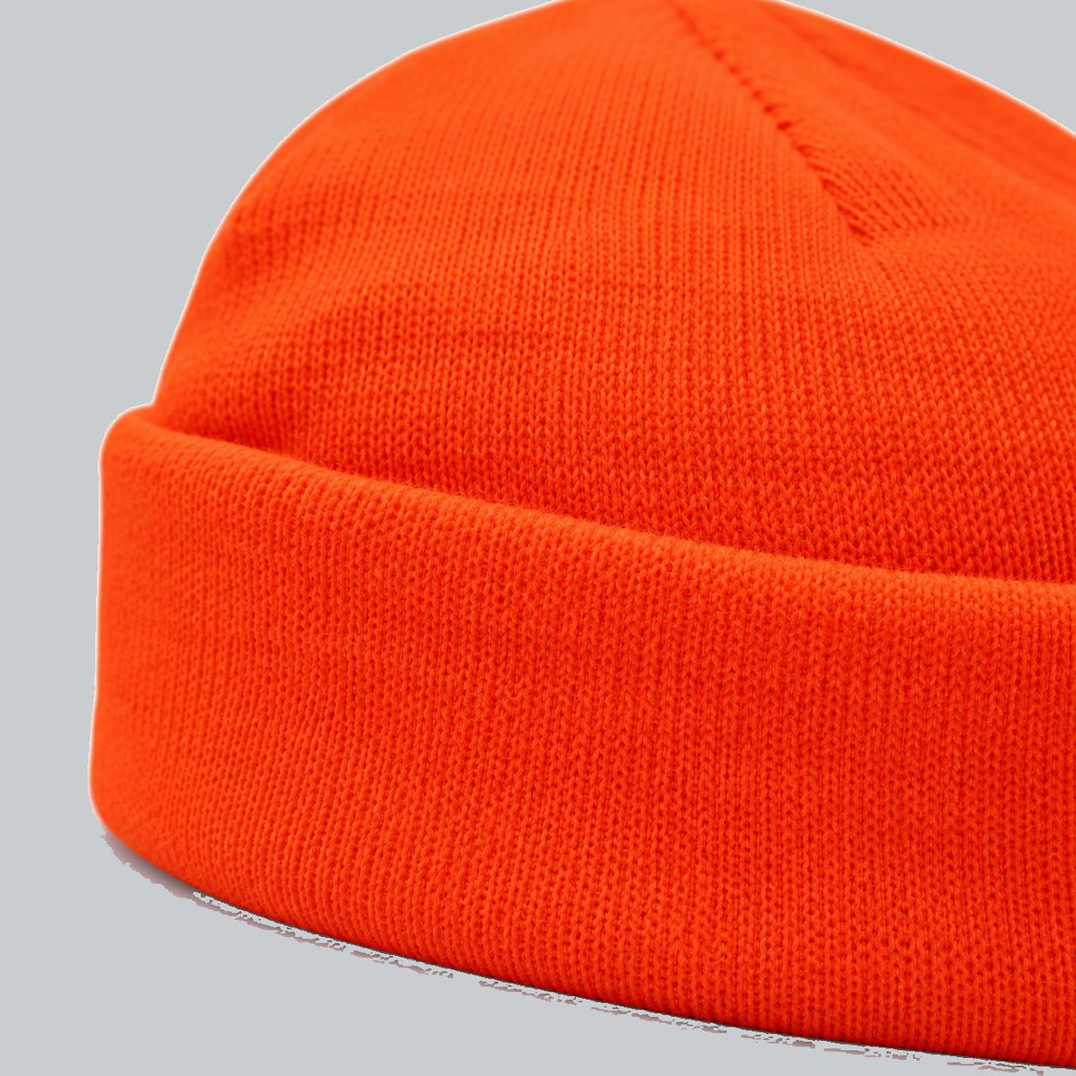 Neon Cuffed Beanie, oblique macro of folded cuff and fine acrylic knit | Color: Neon Orange