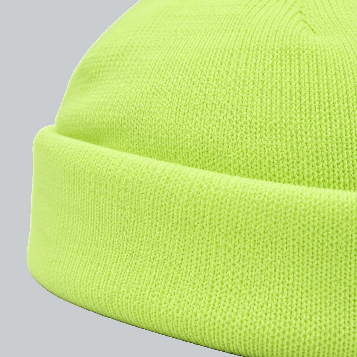 Neon Cuffed Beanie, oblique macro of folded cuff thickness and fine acrylic knit | Color: Neon Yellow
