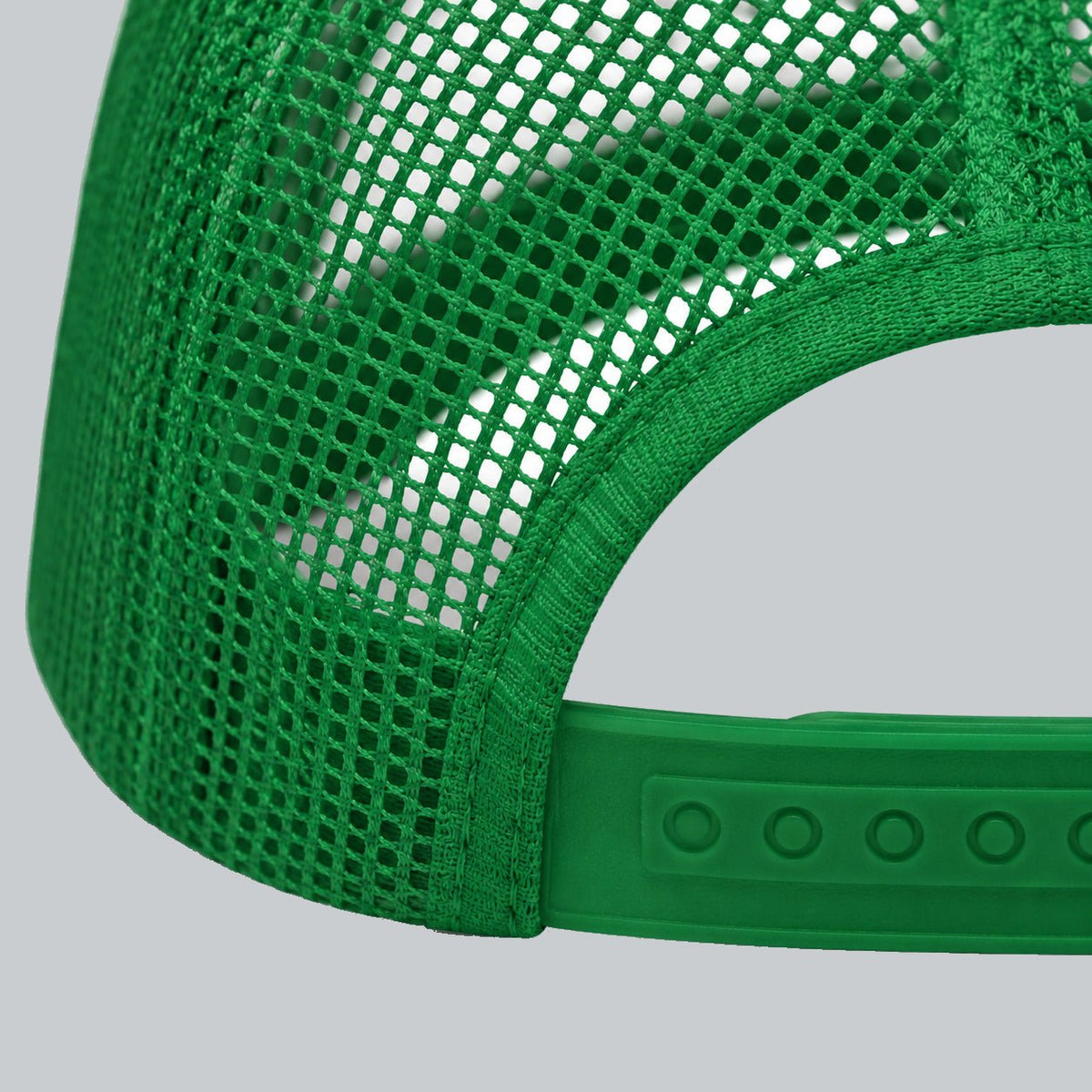 Never a Dull Moment Trucker Hat, oblique macro of mesh, bound back opening and adjustable snap attachment | Color: Fairway (Kelly Green / White)