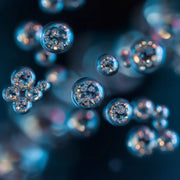 Oemeta HYCUT CF 21 EP power component oil shown as clear micro droplet clusters on a blue coolant surface used by Tech Tool for Hycut coolant systems enhanced EP additives all material safety and added biostability