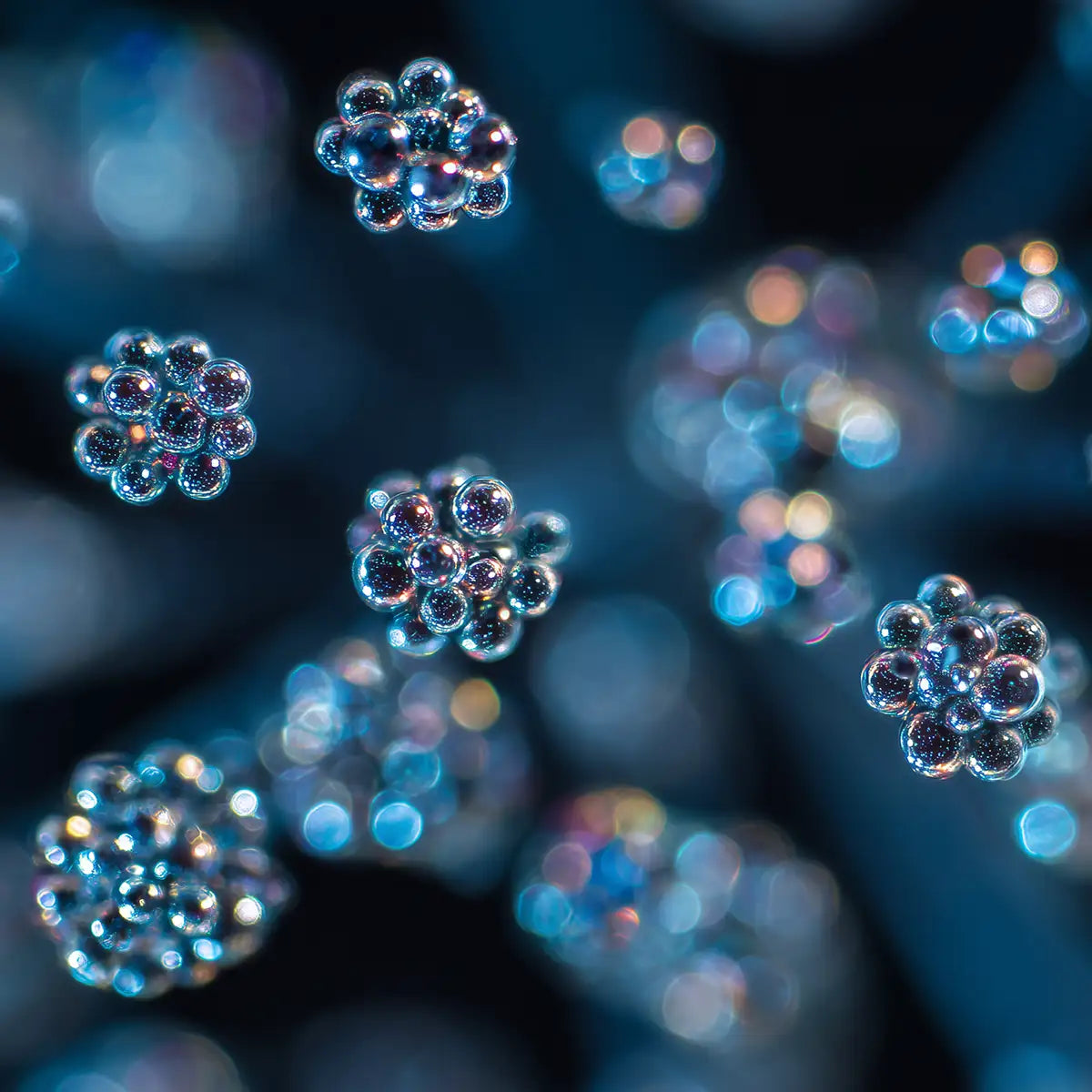 Oemeta HYCUT SW 68 ISO VG 68 lube oil shown as clear micro droplet clusters on a blue coolant surface used by Tech Tool for Hycut coolant systems emulsification and power component oil performance