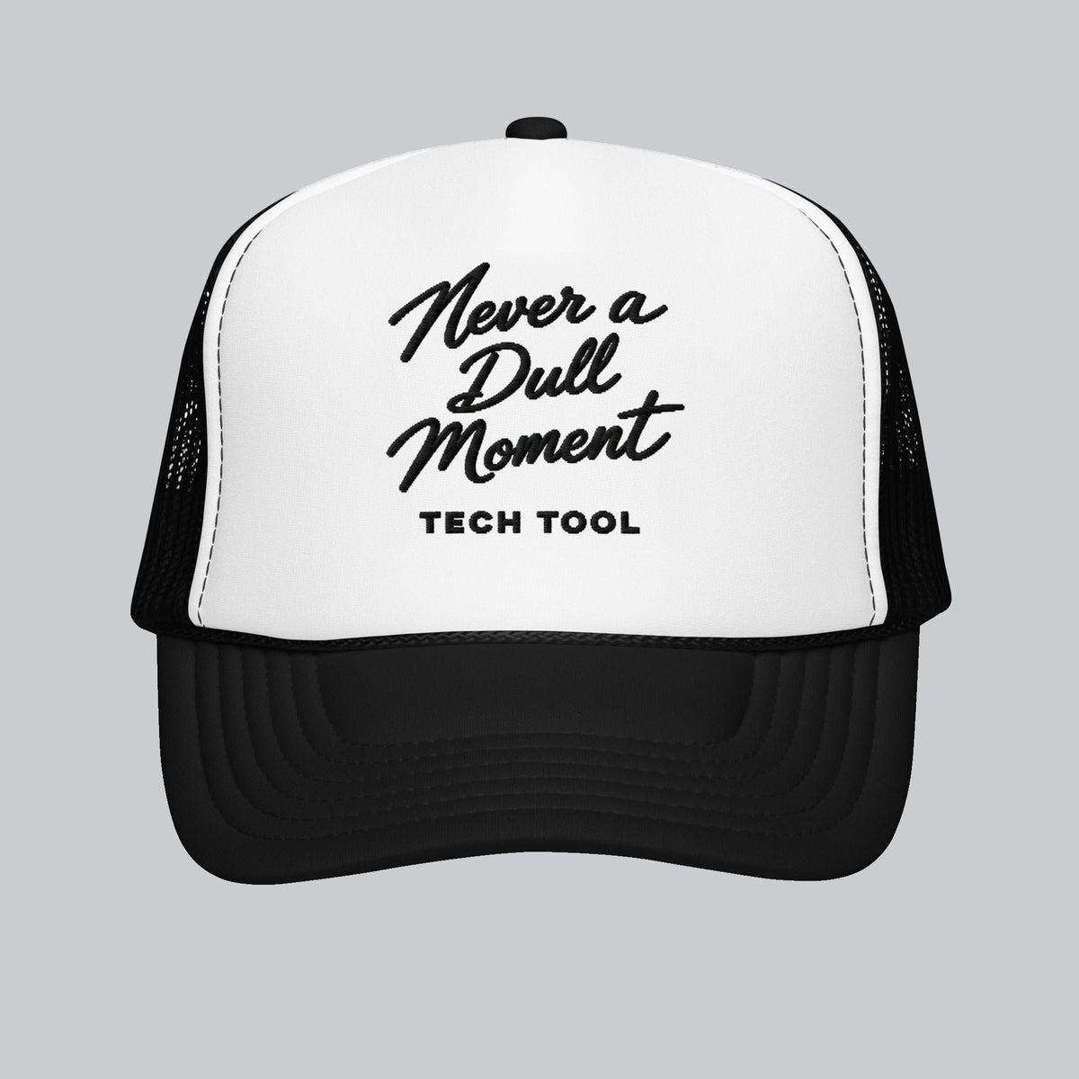 Never a Dull Moment Trucker Hat, front view showing Never a Dull Moment script embroidery and Tech Tool signature | Color: Obsidian (Black / White)