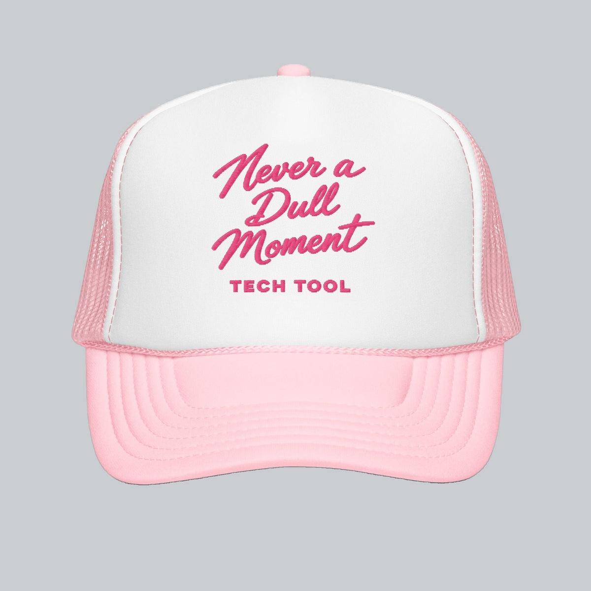Never a Dull Moment Trucker Hat, front view showing Never a Dull Moment script embroidery and Tech Tool signature | Color: Barbie (Light Pink / White)