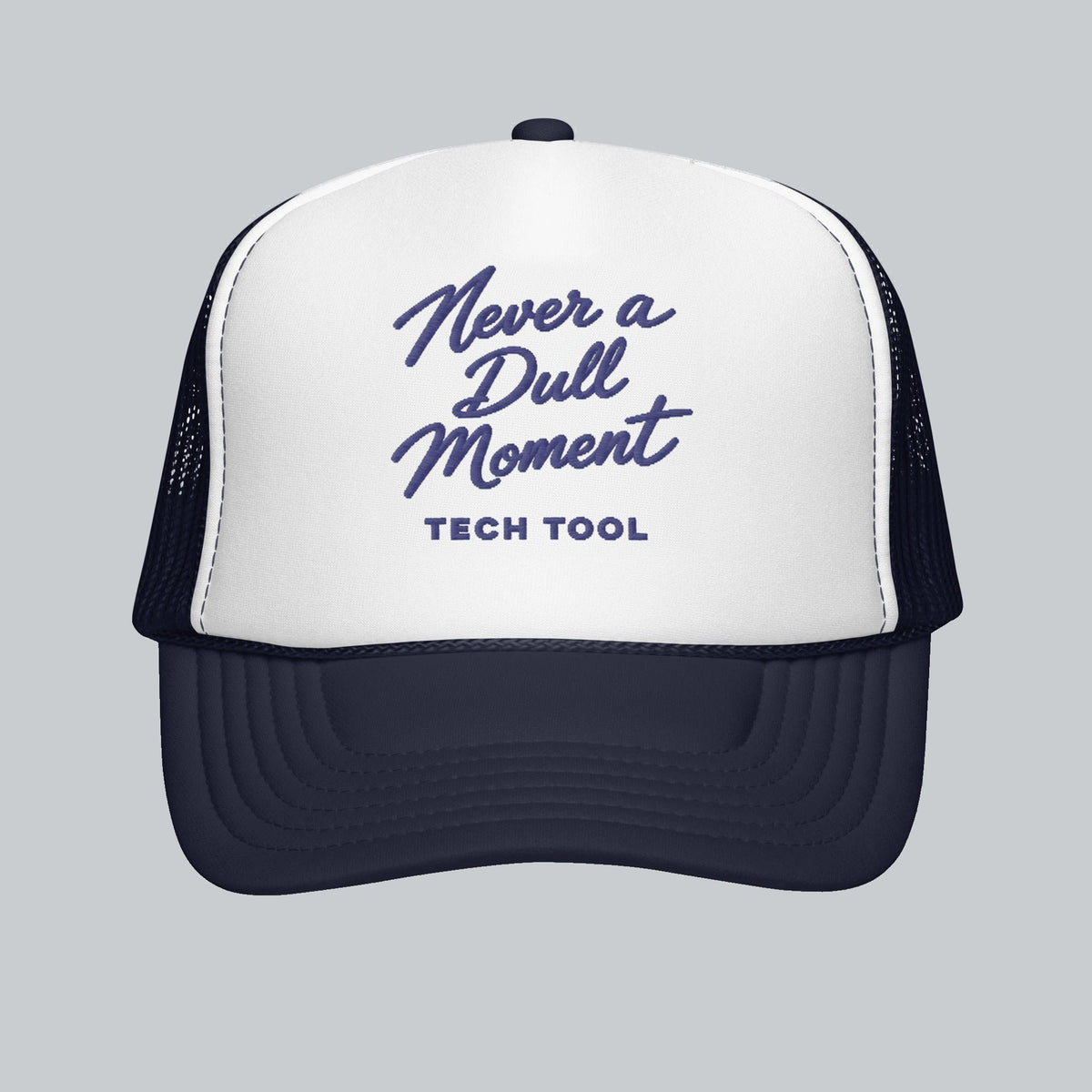 Never a Dull Moment Trucker Hat, front view showing Never a Dull Moment script embroidery and Tech Tool signature | Color: Midnight (Navy / White)