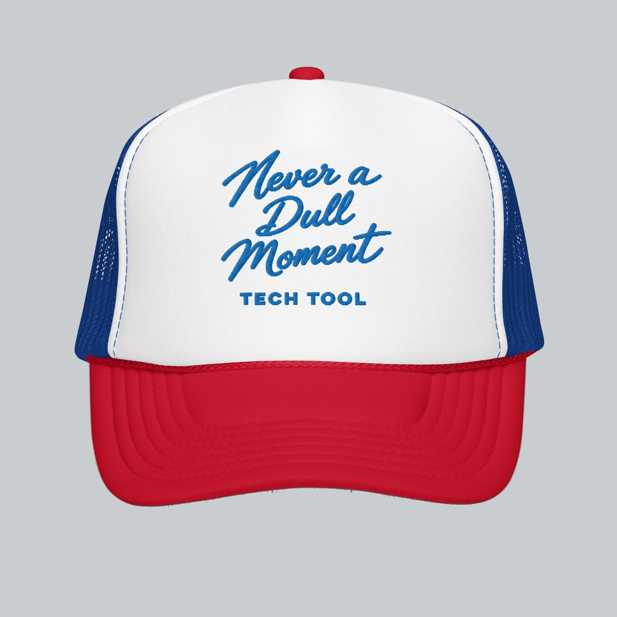 Never a Dull Moment Trucker Hat, front view showing Never a Dull Moment script embroidery and Tech Tool signature | Color: All-American (Red / White / Royal)
