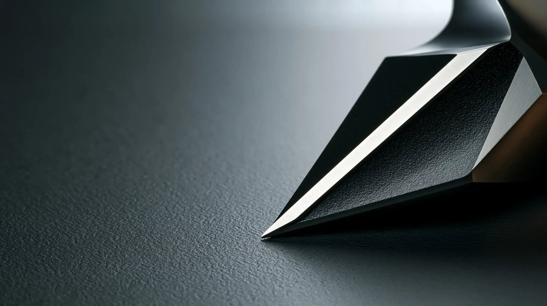 Close-up of a precision carbide cutting tool edge, representing Tech Tool technical machining support and application expertise.