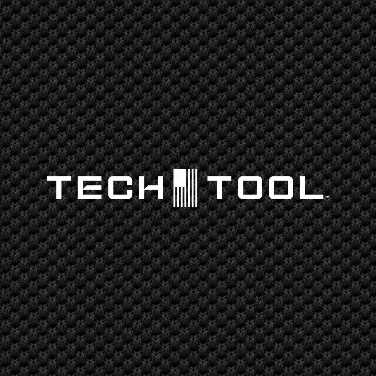 Tech Tool Unisex Core Piqué Polo, macro detail render of the Tech Tool logo and cotton piqué texture | Color: Black
