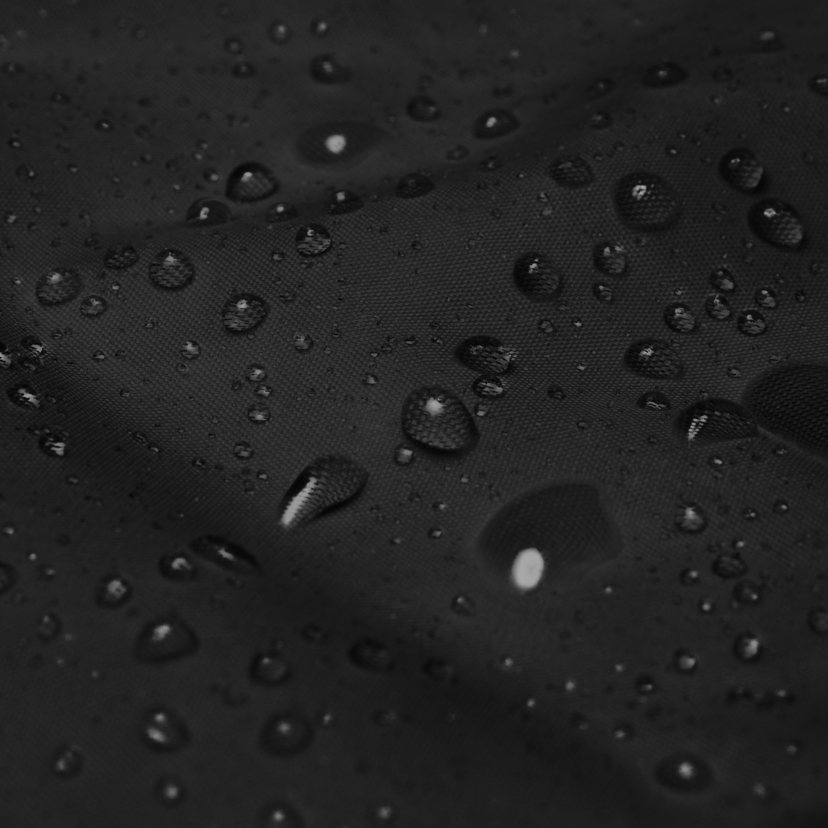 Tech Tool Unisex Core Windbreaker, supplier close-up of the polyamide shell fabric with water droplets | Color: Black