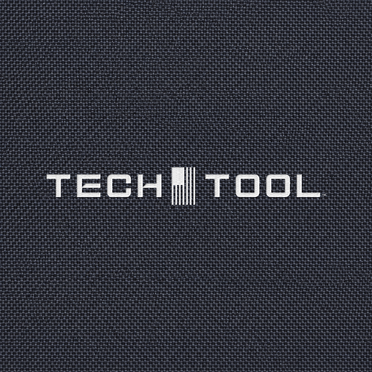 Tech Tool Unisex Core Windbreaker, detailed render of the full Tech Tool embroidery on matching polyamide shell fabric | Color: Navy