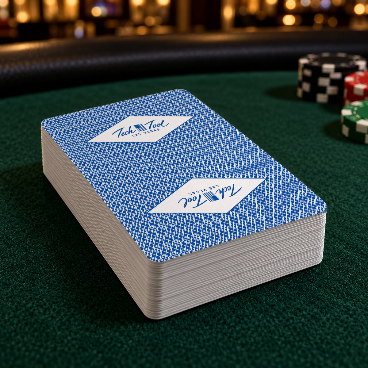 Tech Tool Las Vegas playing cards in blue, deck on a green high-roller poker table | Color: Vegas Blue