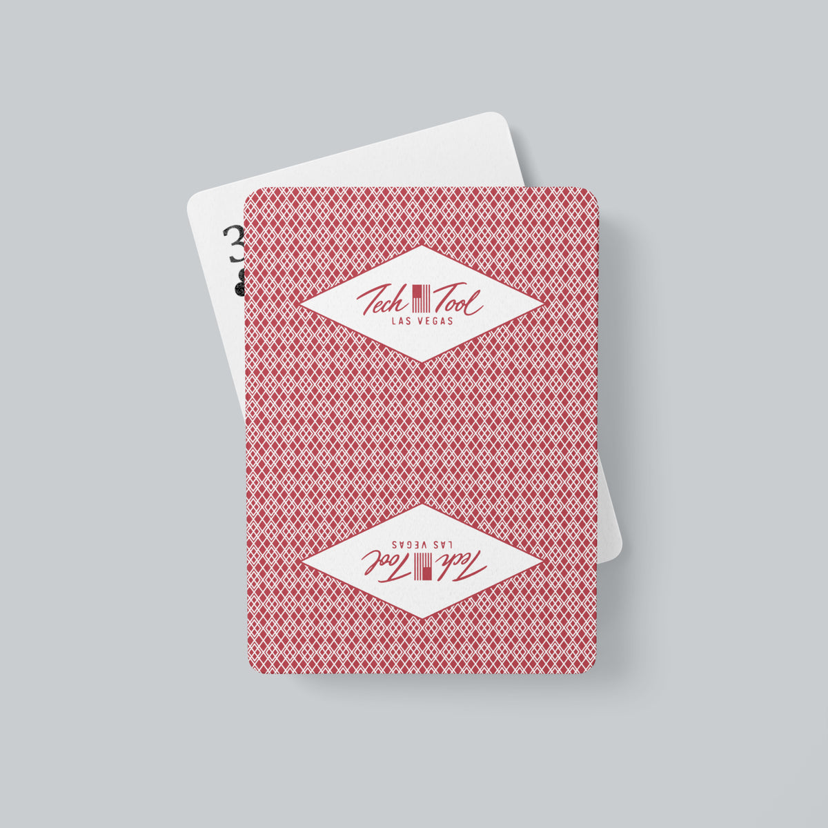 Tech Tool Las Vegas playing cards in red, printed back alongside a face-up card | Color: Vegas Red