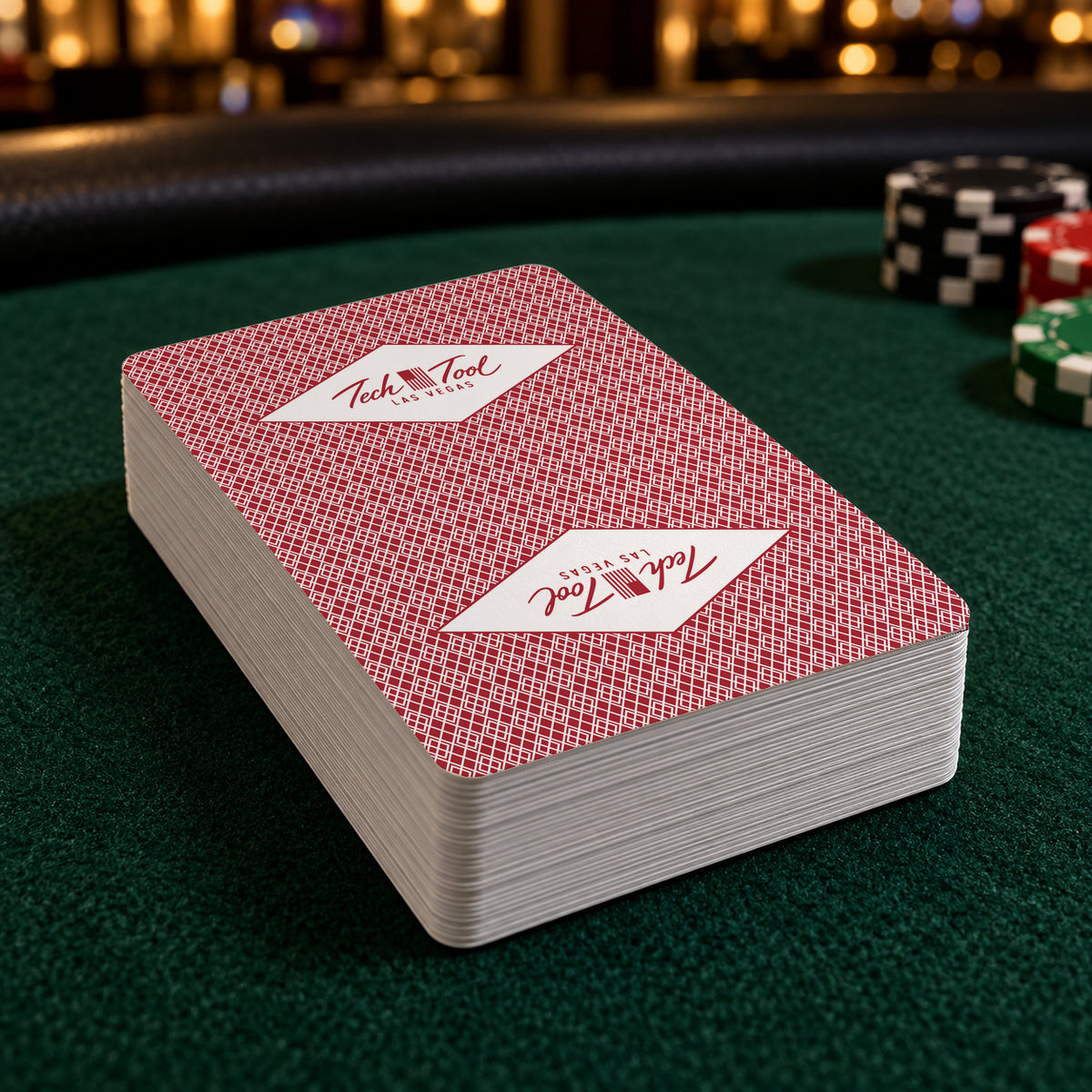 Tech Tool Las Vegas playing cards in red, deck on a green high-roller poker table | Color: Vegas Red