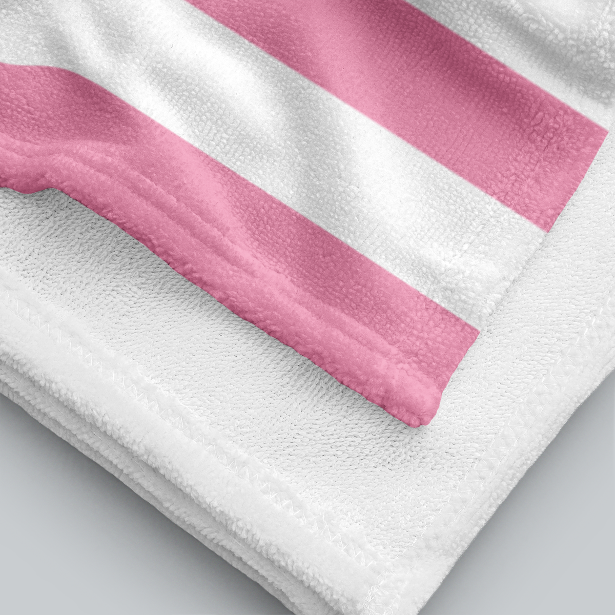 Tech Tool Signature Beach Towel in Barbie Pink, folded printed face and white terry reverse | Color: Barbie Pink