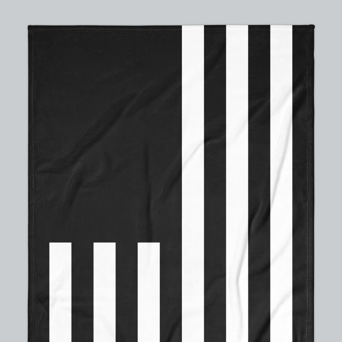 Tech Tool Signature Beach Towel in Black, upper-left flag and stripe detail | Color: Black