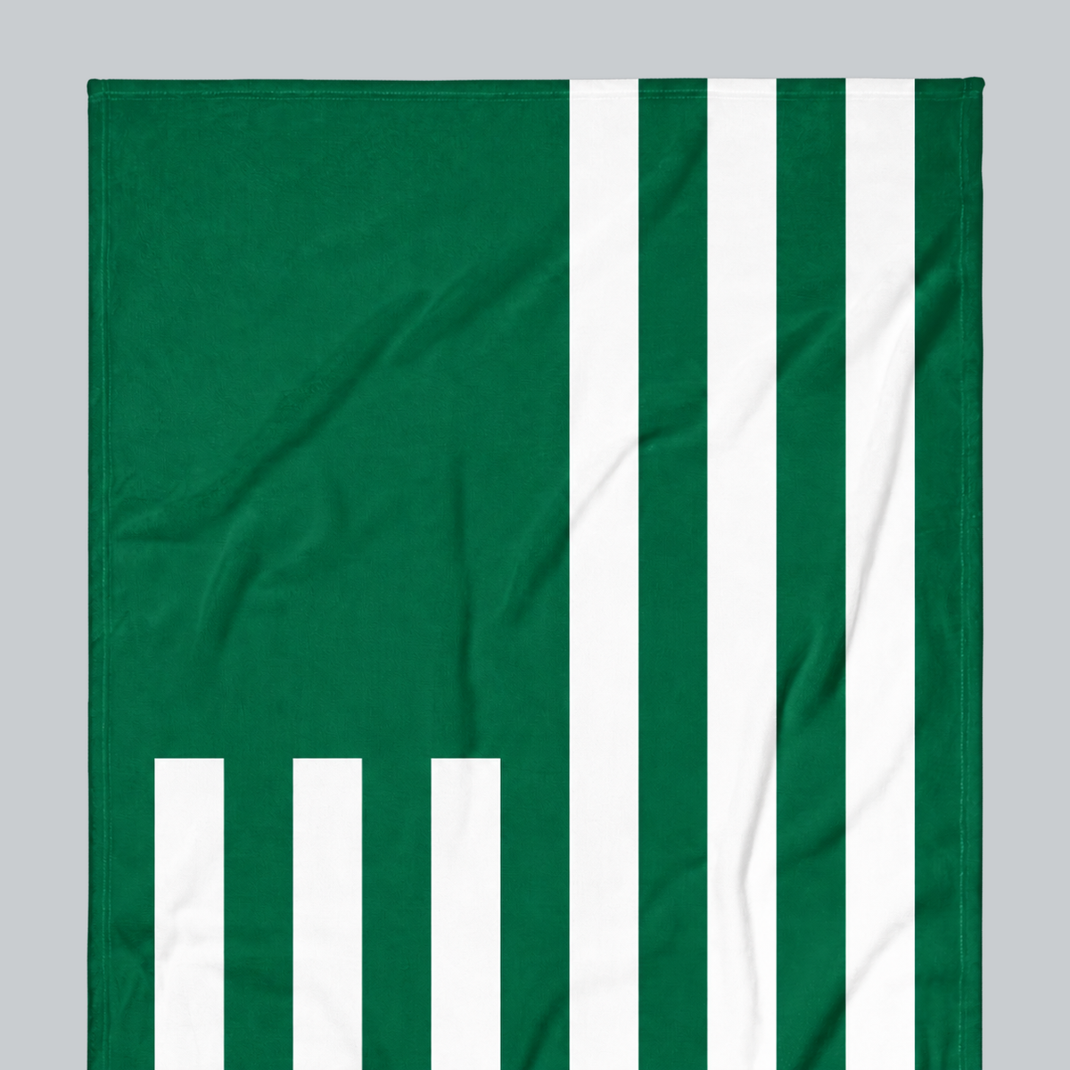 Tech Tool Signature Beach Towel in Golf Green, upper-left flag and stripe detail | Color: Golf Green