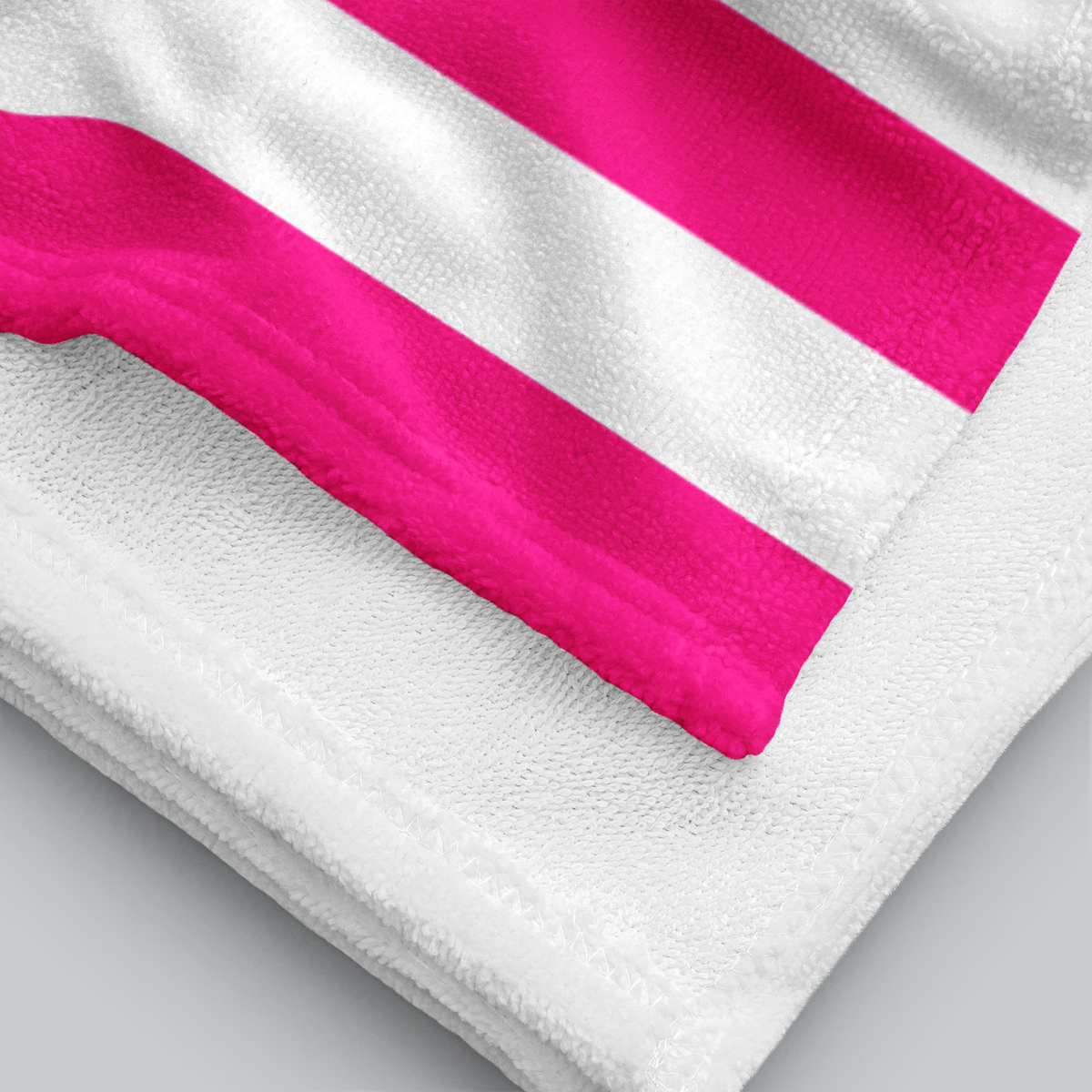 Tech Tool Signature Beach Towel in Hot Pink, folded printed face and white terry reverse | Color: Hot Pink