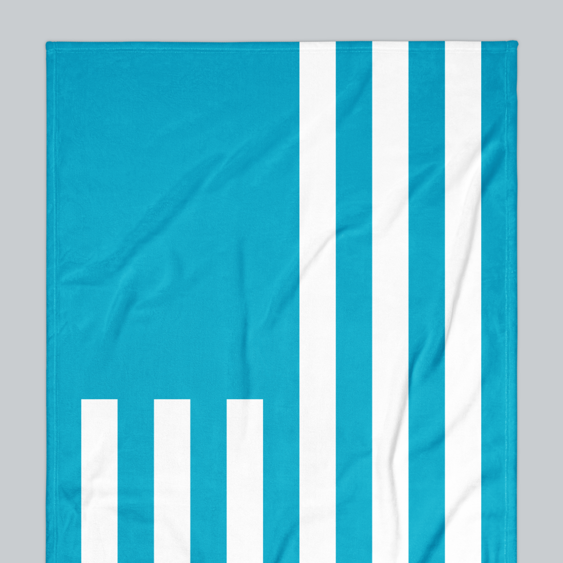 Tech Tool Signature Beach Towel in Tropical Blue, upper-left flag and stripe detail | Color: Tropical Blue