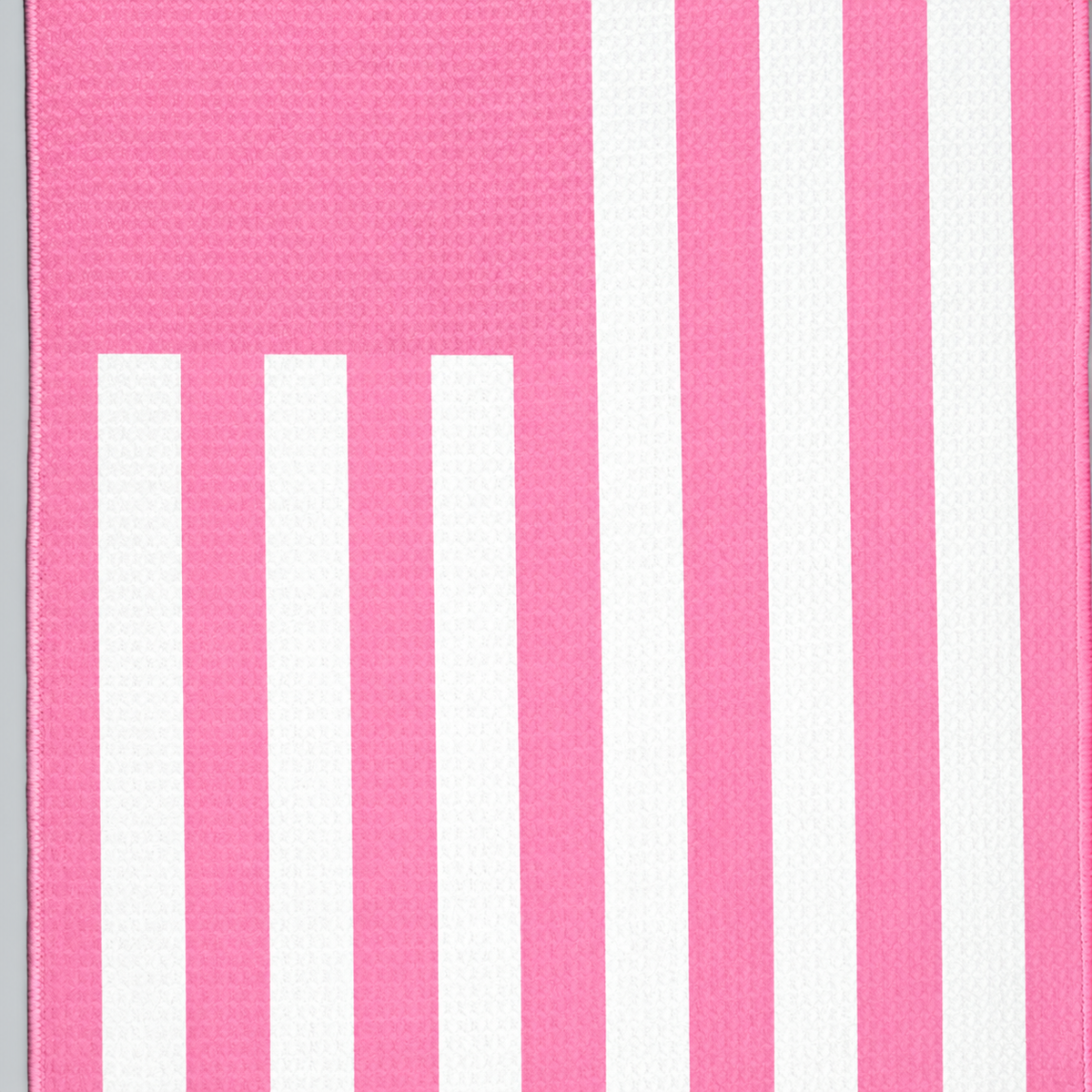 Tech Tool Signature Golf Towel in Barbie Pink, close view of flag stripes and hem | Color: Barbie Pink