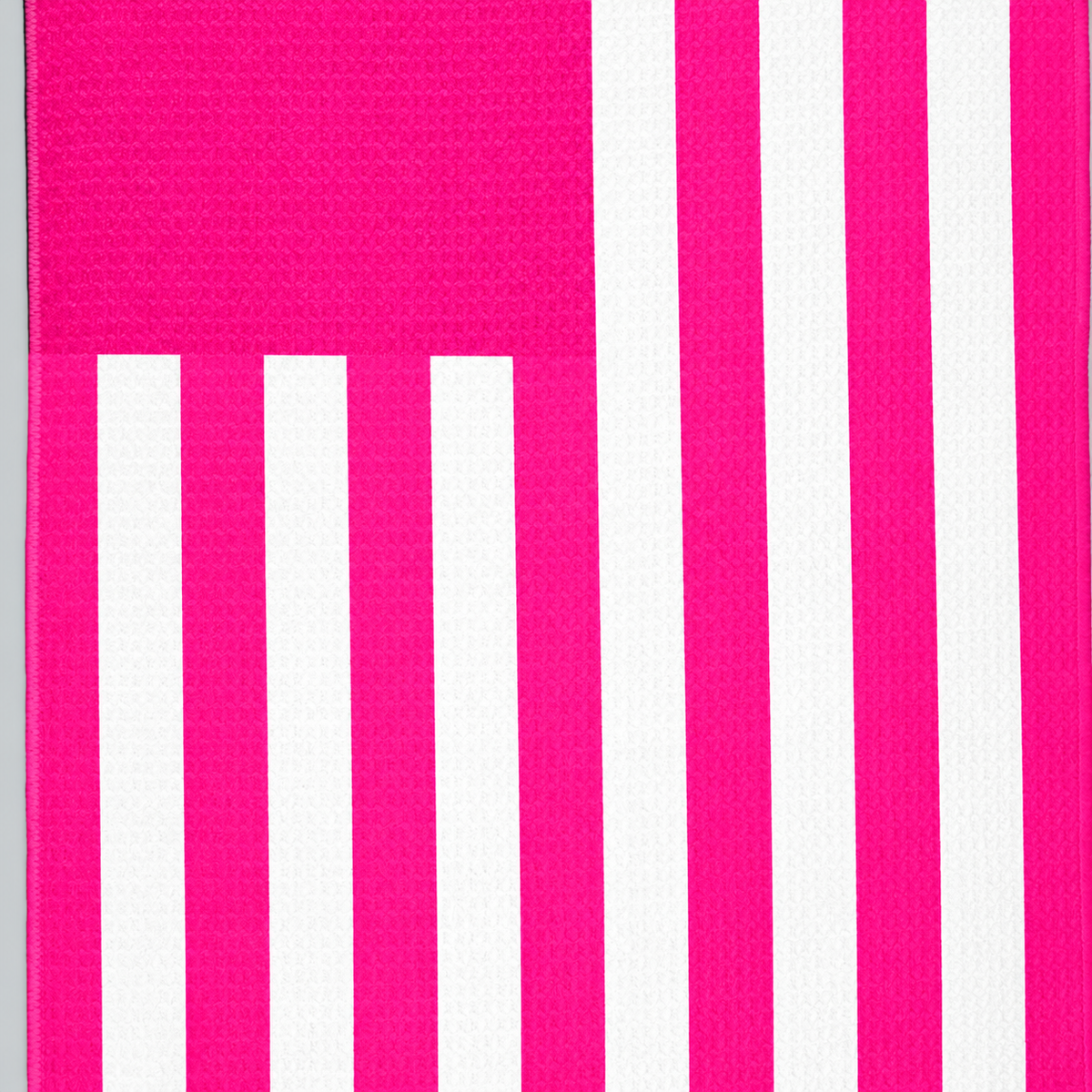 Tech Tool Signature Golf Towel in Hot Pink, close view of flag stripes and hem | Color: Hot Pink