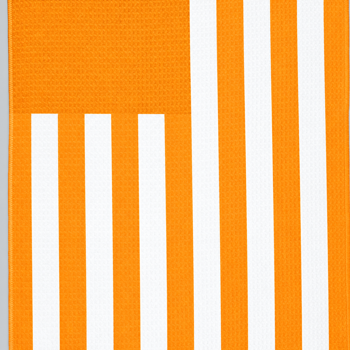 Tech Tool Signature Golf Towel in Mango Orange, close view of flag stripes and hem | Color: Mango Orange