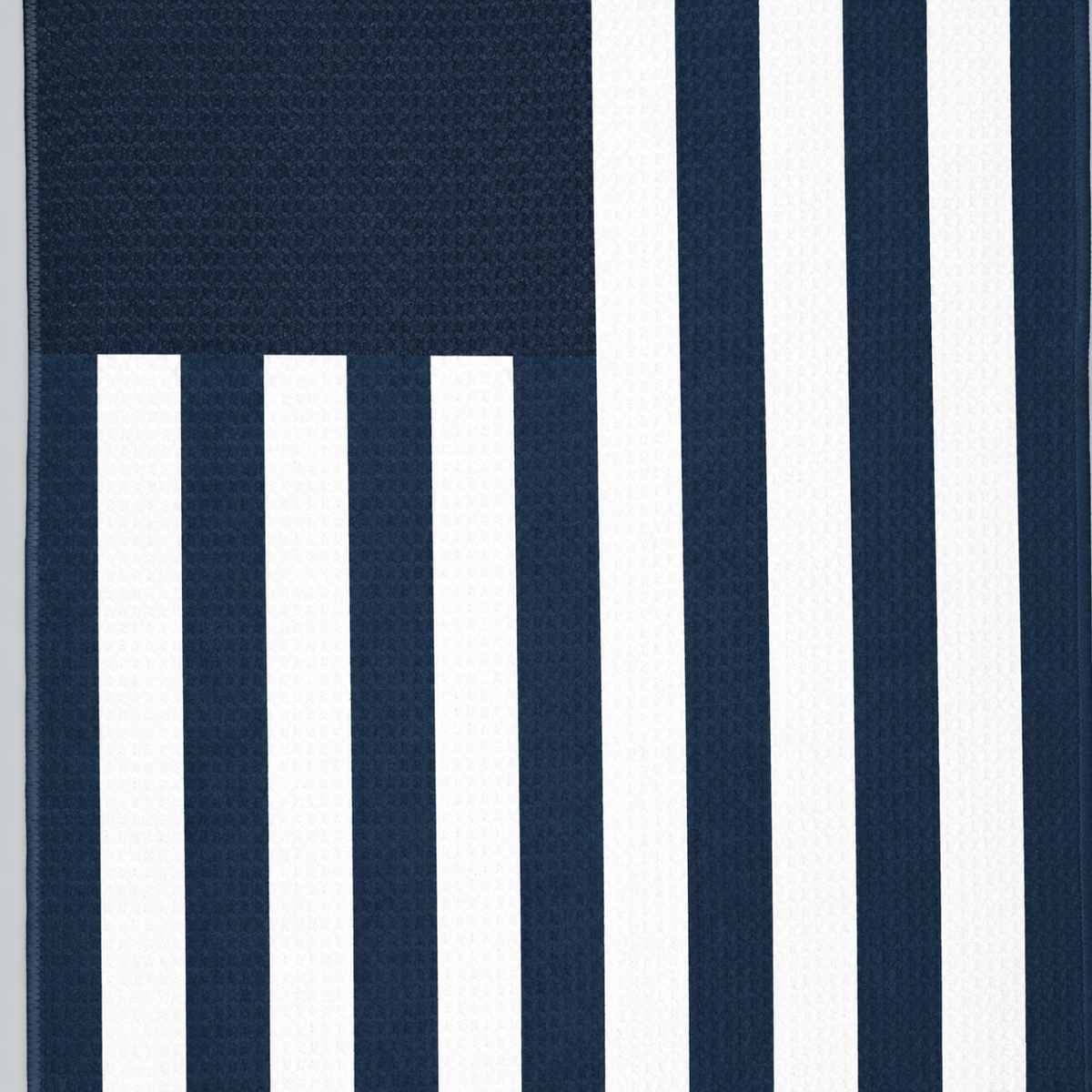 Tech Tool Signature Golf Towel in Navy, close view of flag stripes and hem | Color: Navy