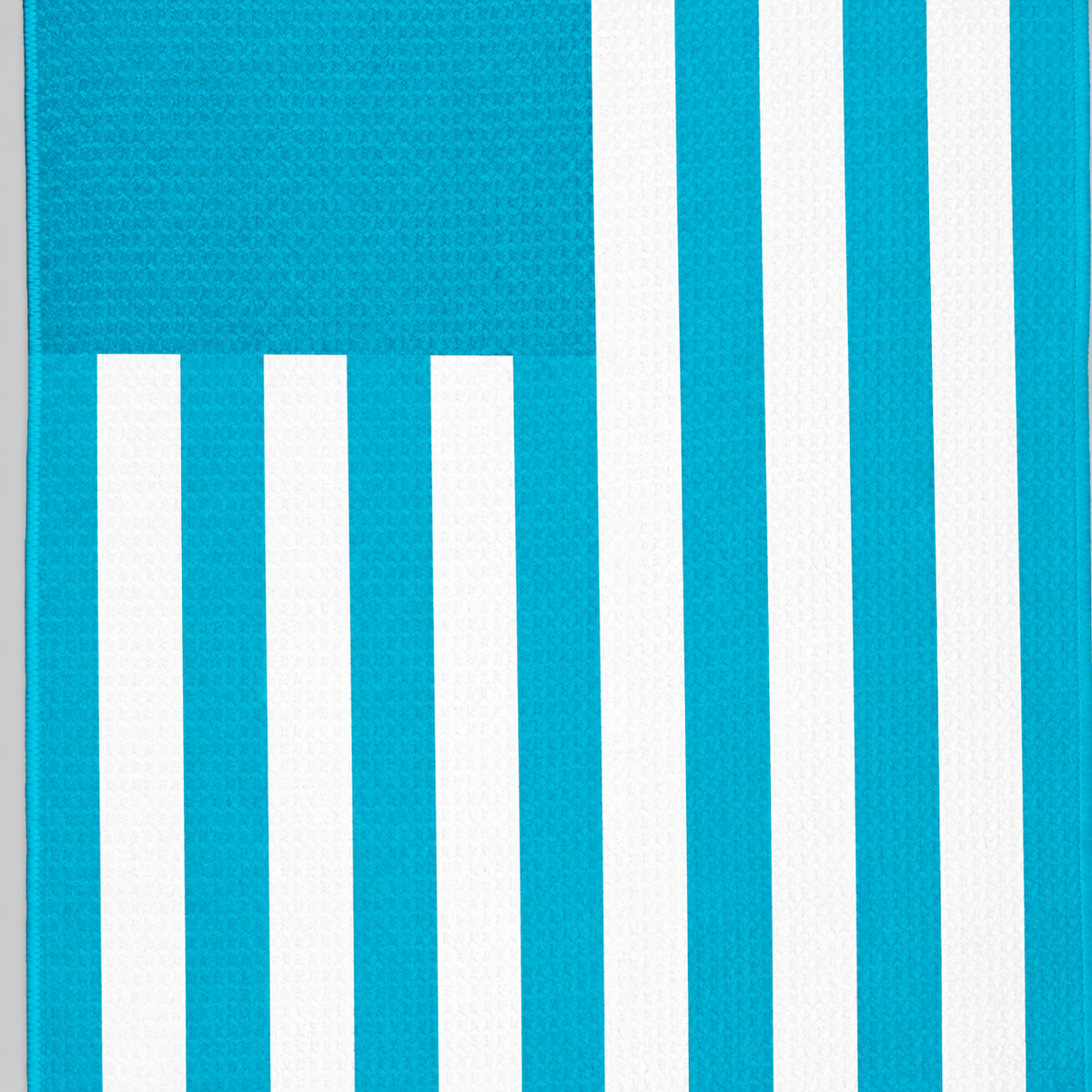 Tech Tool Signature Golf Towel in Tropical Blue, close view of flag stripes and hem | Color: Tropical Blue