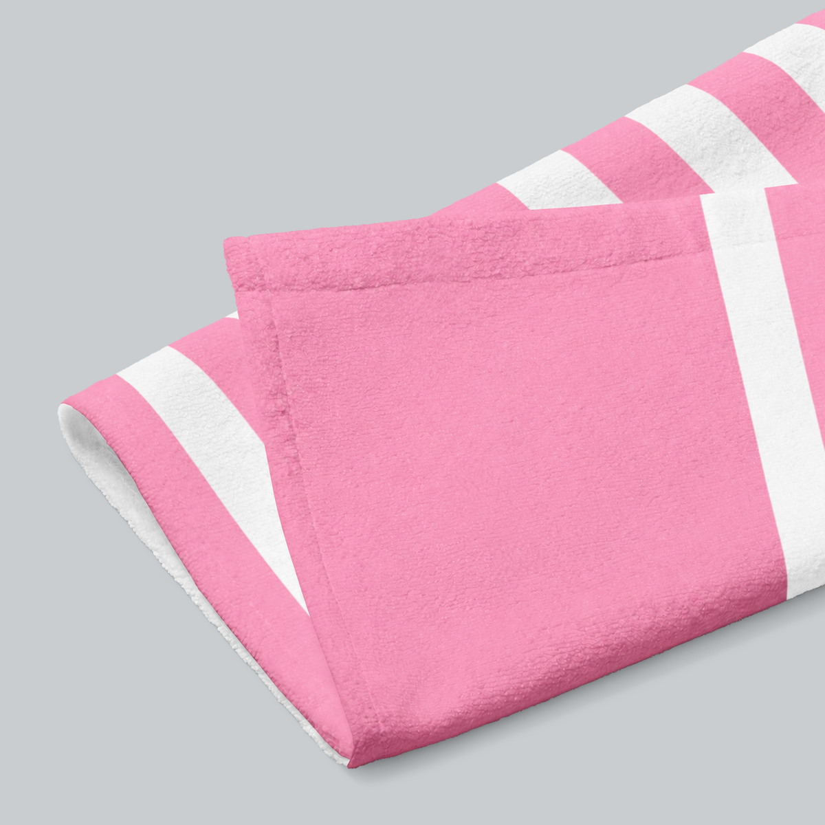 Tech Tool Signature Hand Towel in Barbie Pink, folded print and hem detail with white reverse | Color: Barbie Pink