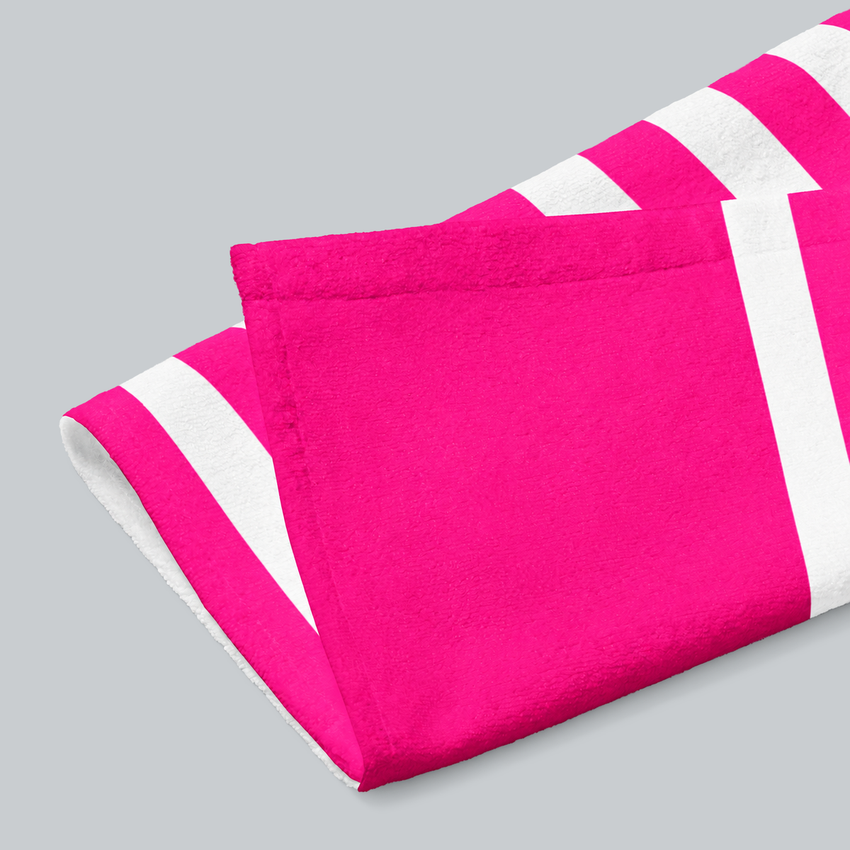 Tech Tool Signature Hand Towel in Hot Pink, folded print and hem detail with white reverse | Color: Hot Pink