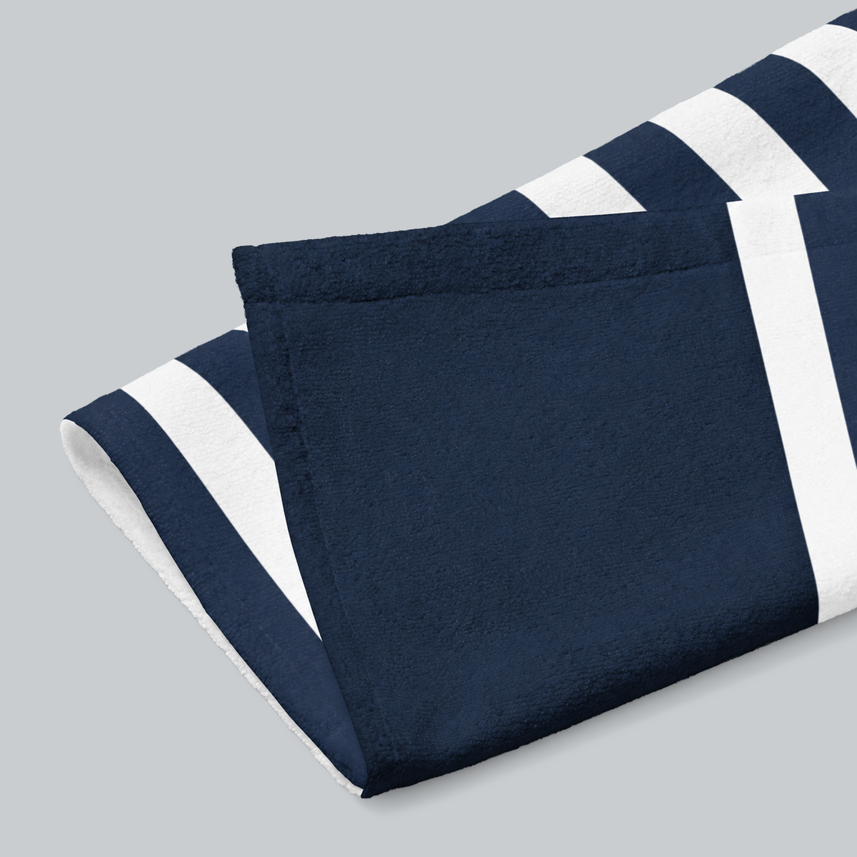 Tech Tool Signature Hand Towel in Navy, folded print and hem detail with white reverse | Color: Navy