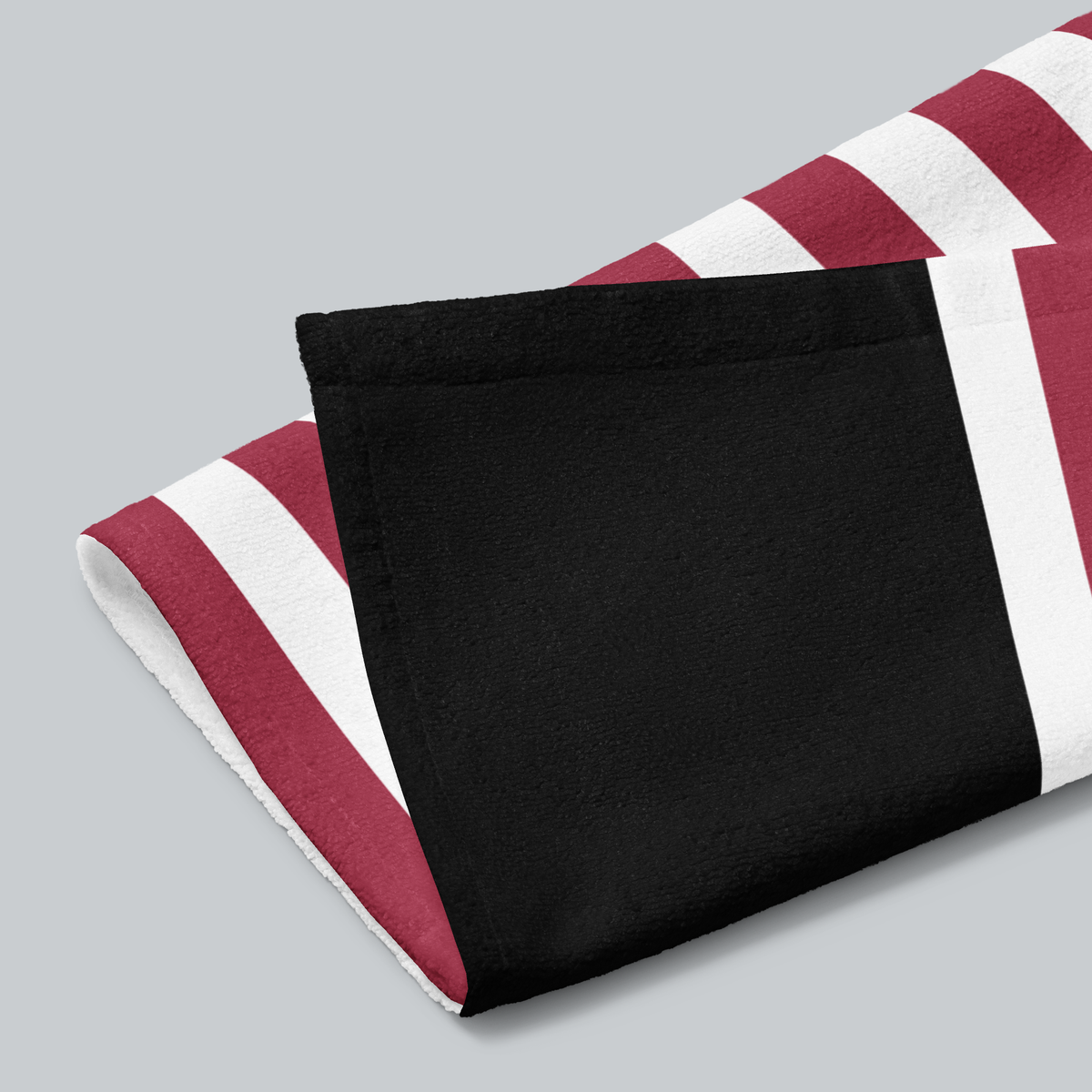 Tech Tool Signature Hand Towel in Signature, folded print and hem detail with white reverse | Color: Signature
