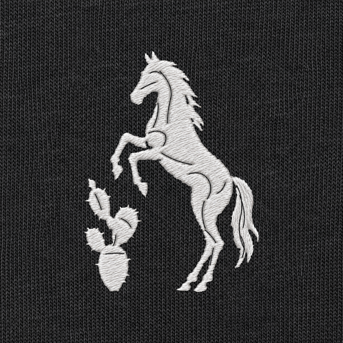 Tech Tool Texas embroidered tee in Black, embroidery detail render of the white horse-and-cactus emblem on cotton jersey | Color: Black