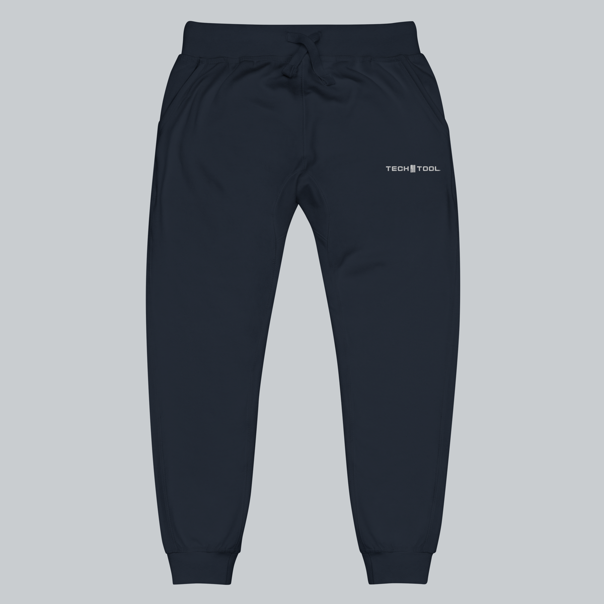 Tech Tool Unisex Core Fleece Joggers, front view showing upper-left-thigh Tech Tool embroidery, drawcord waist and cuffed legs | Color: Navy Blazer